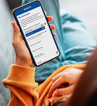 A woman looking at the esure website on a smartphone